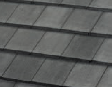 Close-up view of gray slate roof shingles arranged in neat, overlapping horizontal rows.
