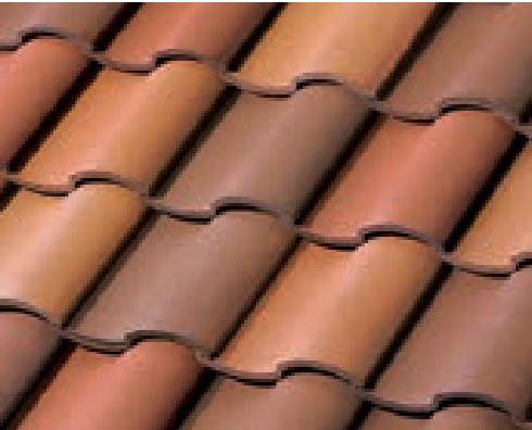 Close-up view of overlapping terracotta roof tiles in shades of brown, tan, and red, arranged in neat, wavy rows.