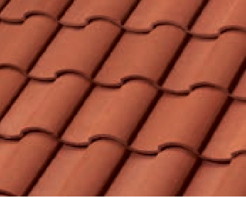 Close-up view of overlapping red clay roof tiles arranged in a neat, repeating pattern.