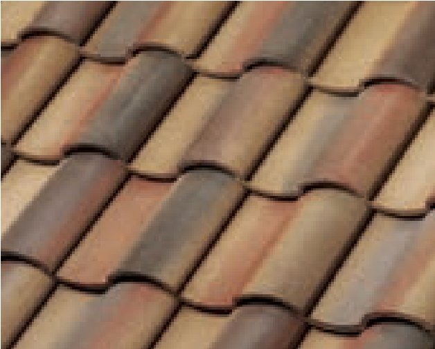Close-up view of overlapping brown and tan ceramic roof tiles arranged in a repeating, wavy pattern. The tiles appear weathered with varying shades of earth tones.