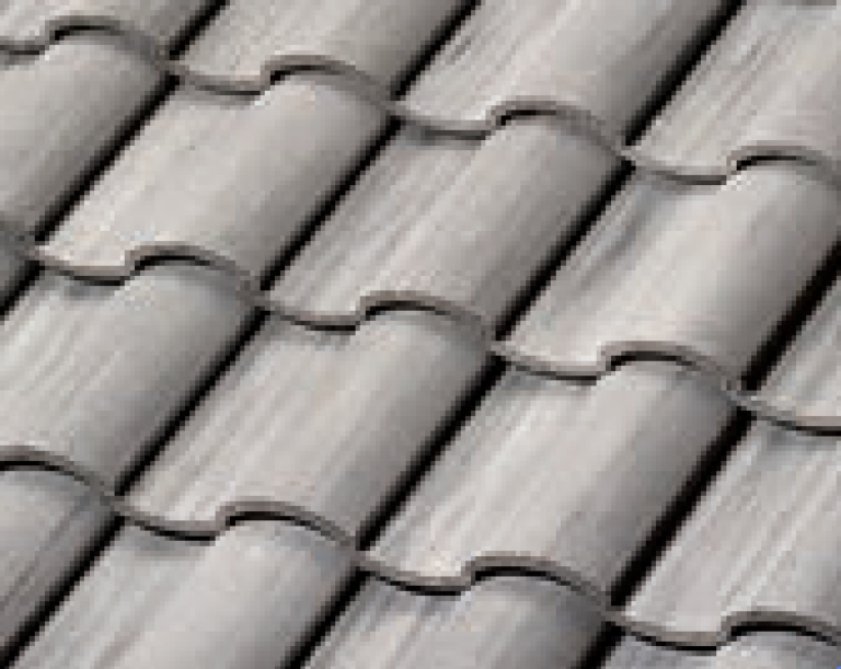 Close-up view of overlapping gray ceramic roof tiles arranged in a wavy, repeating pattern. The tiles have a textured surface and are neatly aligned in horizontal rows.