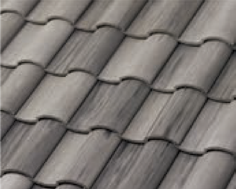 Close-up view of overlapping gray roof tiles arranged in a regular, wavy pattern. The tiles have a textured surface and are neatly aligned in horizontal rows.