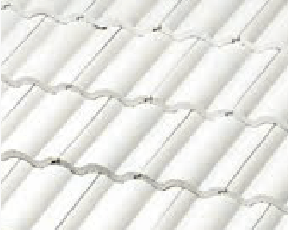 Close-up view of several rows of white corrugated roofing sheets placed in a horizontal wave-like pattern.