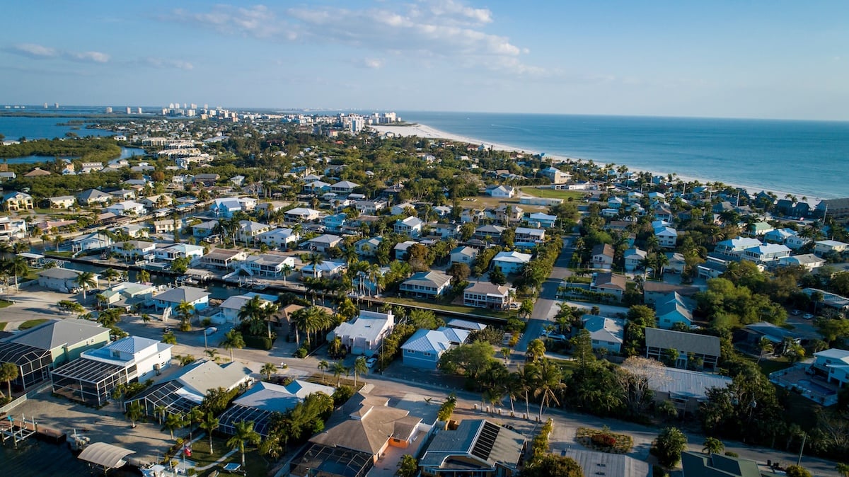 Aerial view of a coastal town with numerous houses