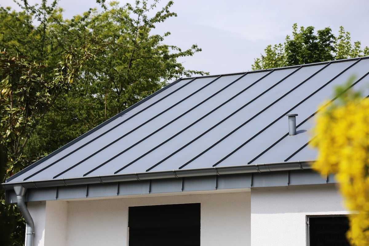 A modern house with a gray metal roof