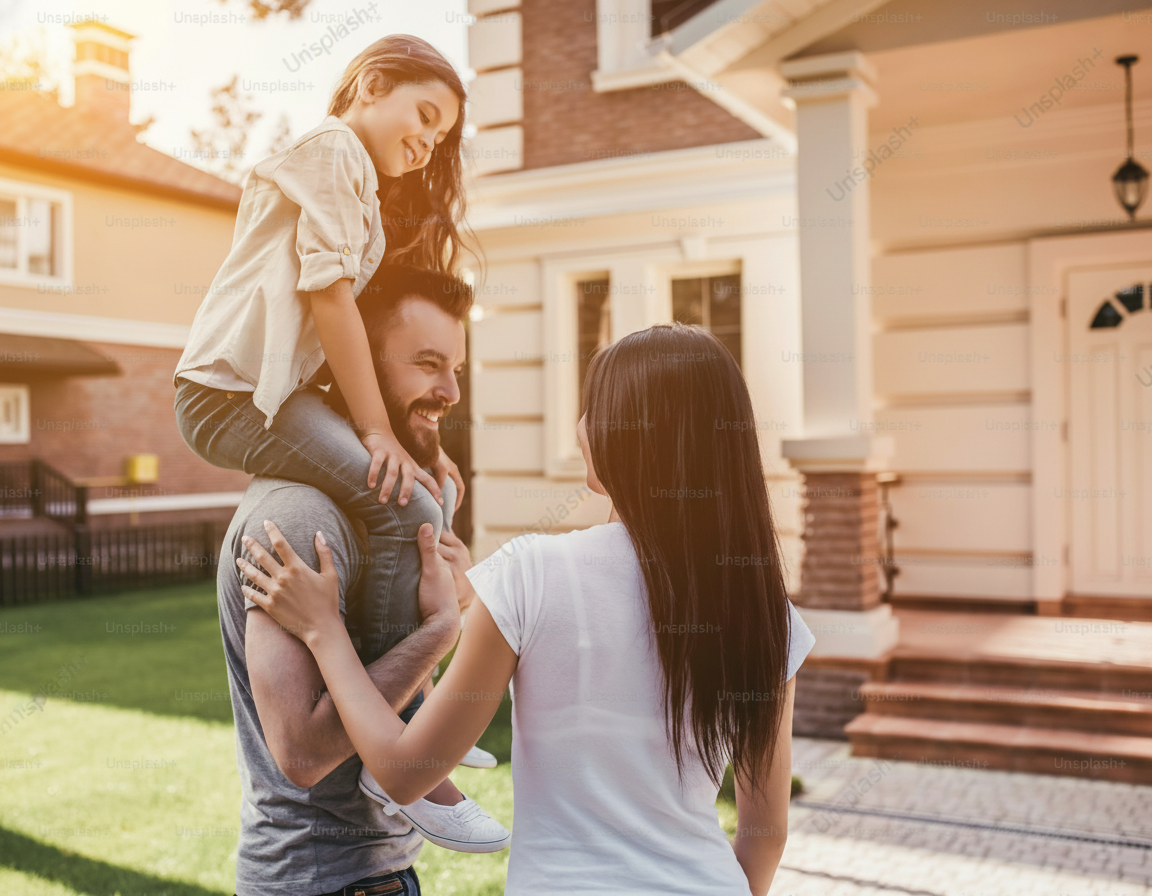 Family standing confidently in front of their home with quality roof protection and warranty coverage