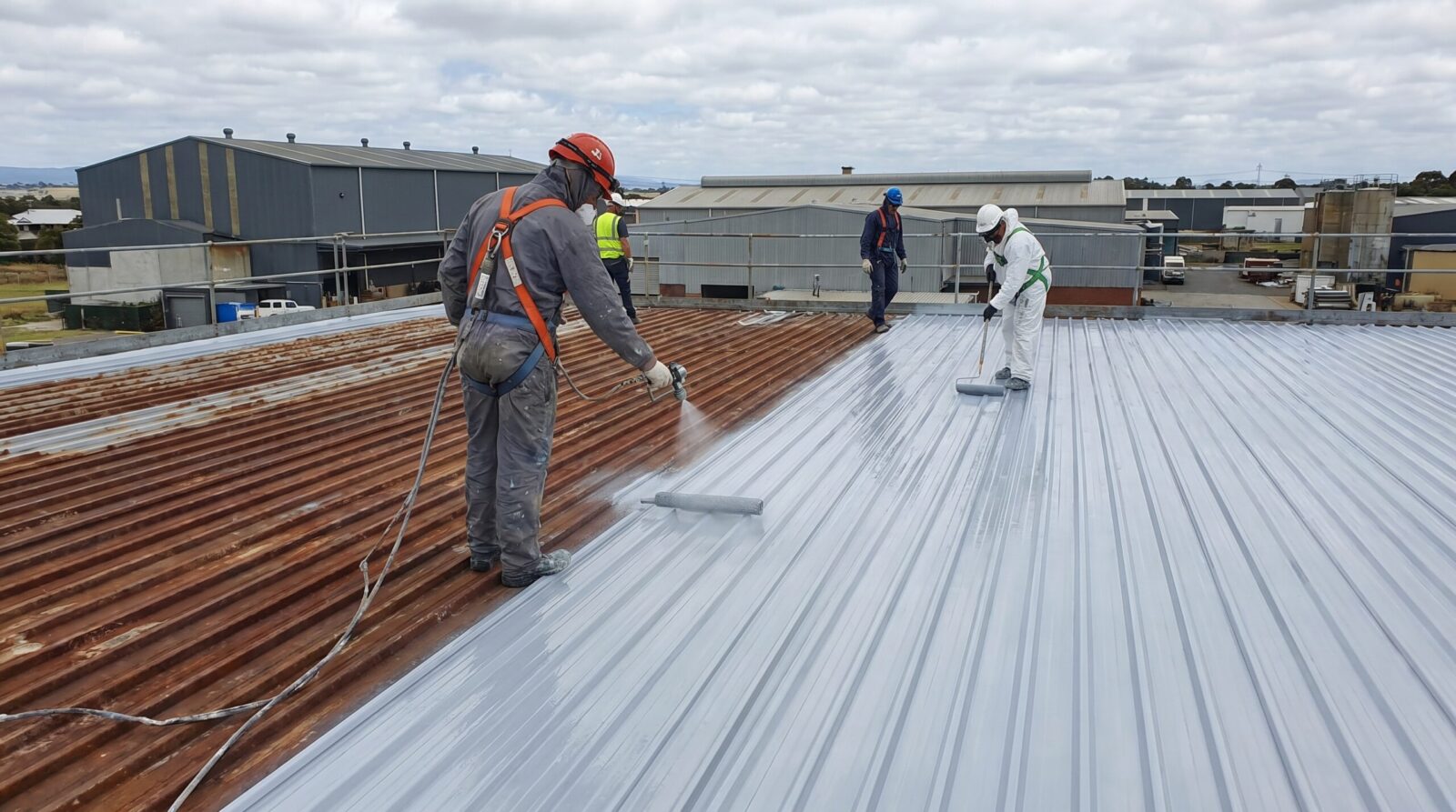 metal roof installation showing coating application process